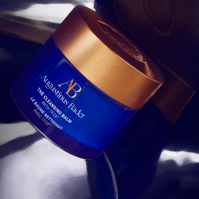 Augustinus Bader The Cleansing Balm jar with blue and gold packaging