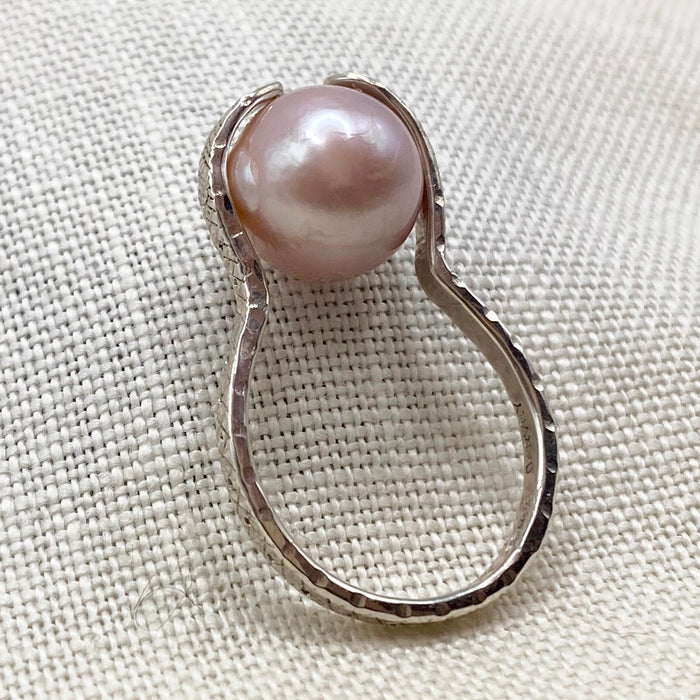 Sterling silver snake ring with blush pearl, side view