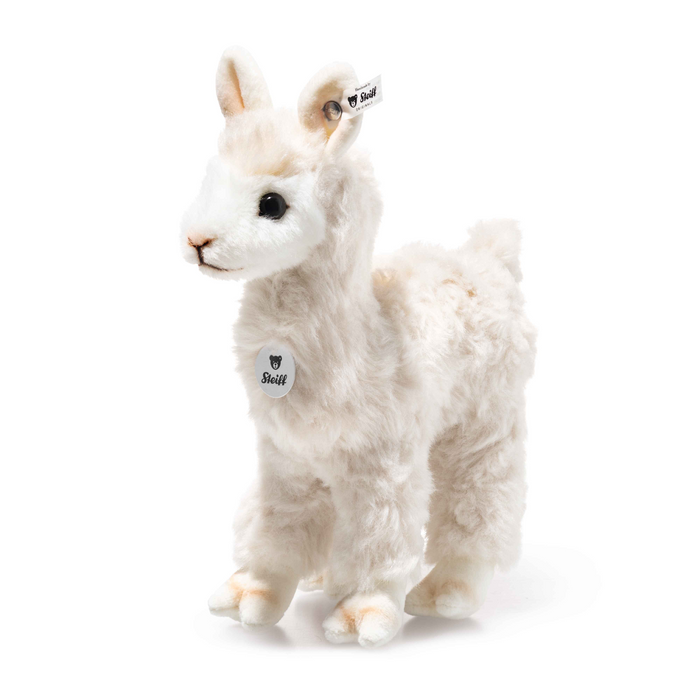 Alpaca plush toy with soft white fur, stitched eyes, and round brand tag