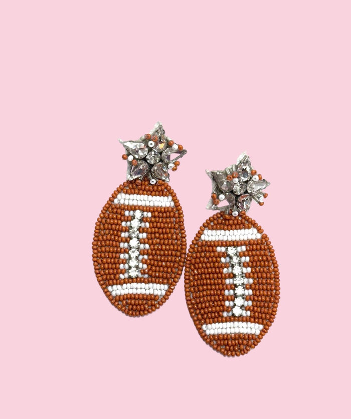Burnt orange beaded football-shaped earrings by Camel Threads featuring flathead design with intricate beadwork.