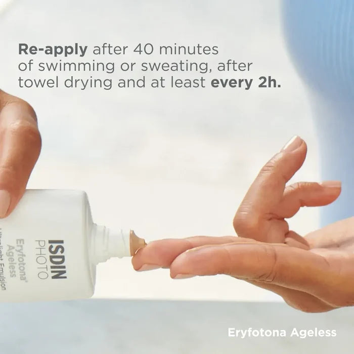 ISDIN Eryfotona Ageless tinted mineral sunscreen applied to a finger, SPF 50