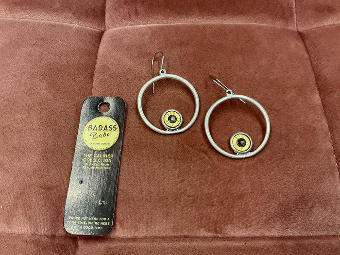 Silver hoop earrings with bezel detailing by BadAssBabe, showcasing a stylish and modern jewelry design.