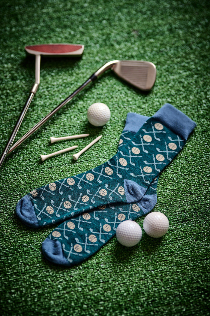 Golf-themed crew socks, dark teal with golf ball and club motifs