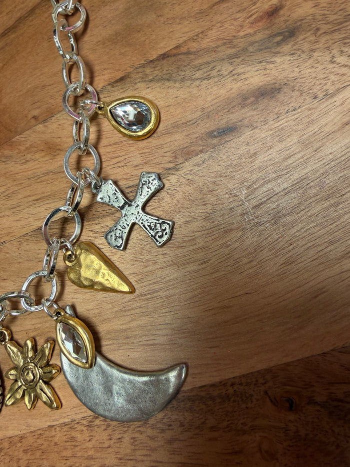 Lula 'n' Lee Charmed by the Moon necklace featuring a crescent moon pendant on a delicate chain.