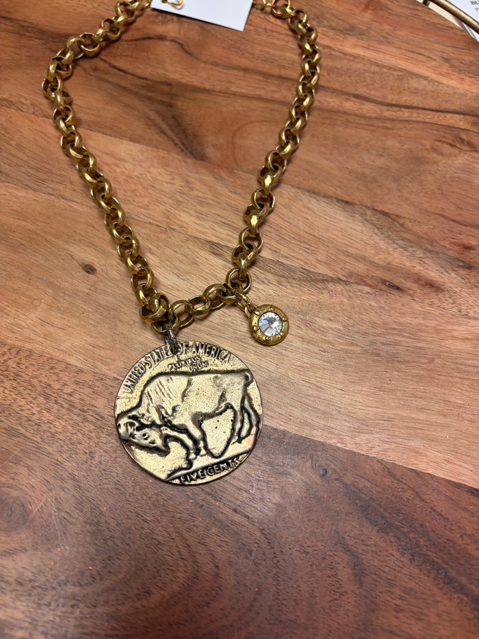 Buffalo coin and crystal necklace by Lula 'n' Lee featuring a silver chain with a coin pendant and sparkling crystal accents.