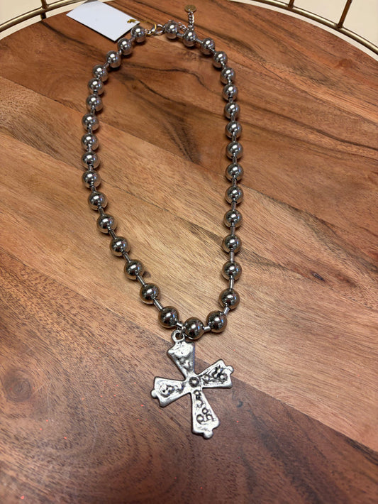 Lula 'n' Lee ball chain cross necklace showing a silver cross pendant on a ball chain necklace.