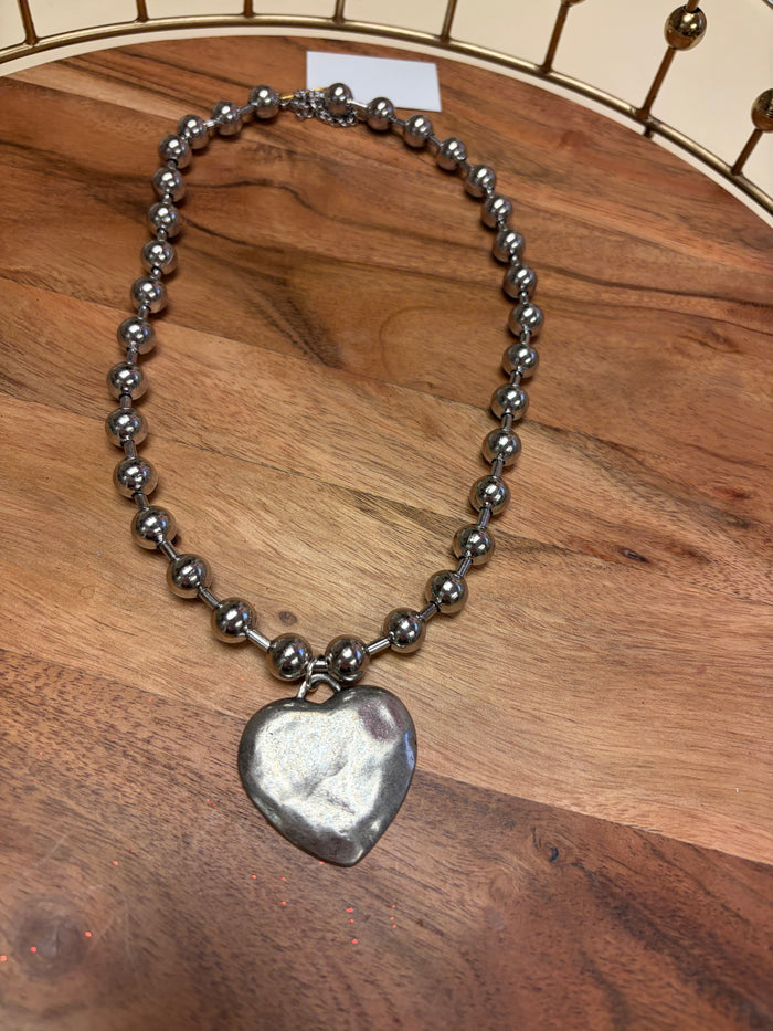 Lula 'n' Lee Ball Chain Heart Necklace featuring a delicate chain and heart pendant, elegant jewelry accessory.