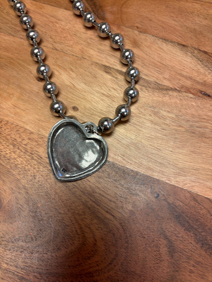 Lula 'n' Lee ball chain heart necklace featuring a delicate heart pendant on a sleek ball chain, close-up view.