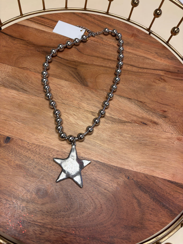 Lula 'n' Lee ball chain star necklace featuring a delicate star pendant on a sleek metal chain.