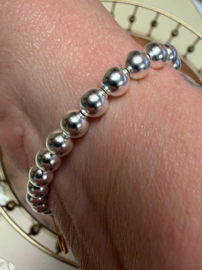 Sterling silver beaded bracelet with round beads from Lula 'n' Lee, showcasing a stylish and elegant jewelry accessory.