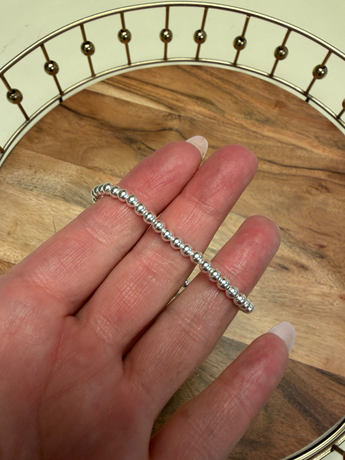 Sterling silver beaded bracelet by Lula 'n' Lee with round silver beads and adjustable clasp, displayed on a neutral background.
