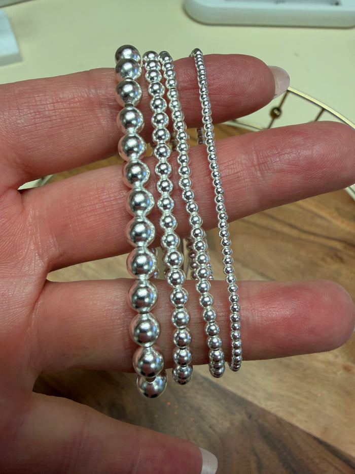 Sterling silver beaded bracelet by Lula 'n' Lee, featuring polished round beads on a delicate chain.