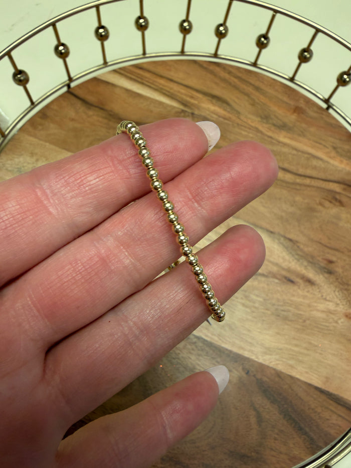 Gold filled beaded bracelet by Lula 'n' Lee featuring small round beads and a delicate design.