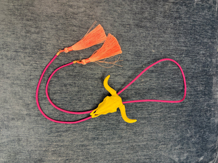 Rahya Bolo Necklace from Rahya Jewelry Design featuring a stylish bolo tie with decorative metal tips and intricate design details.