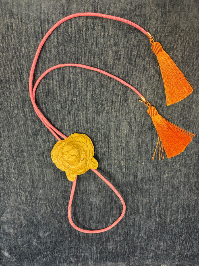 Rahya Bolo Necklace featuring a sleek bolo tie design with metallic accents from Rahya Jewelry Design.