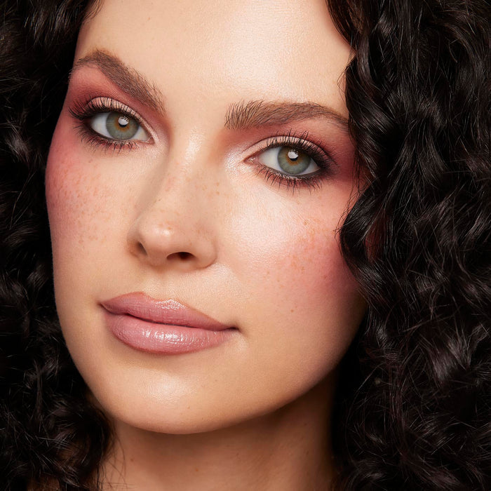 Model showcases rosy mauve eyes and flushed cheeks created with Baby Got Blush, a ColourPop Shadow Palette Set, with matte and shimmer shades blended on lids and lower lash line; studio close-up highlights soft pink tones and natural freckles.