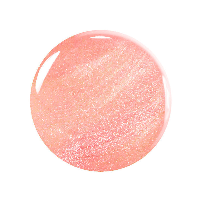 A round, glossy droplet of Betty Scarlett Stella Trio nail polish by Manucurist in peach-pink with a shimmering glitter finish and reflective shine, displayed against a white background.