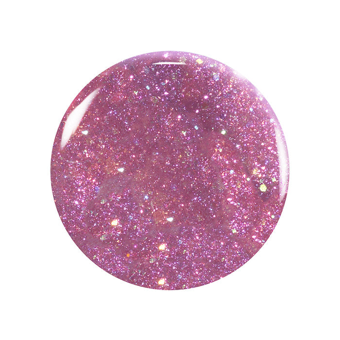 A round drop of Manucurist Betty Scarlett Stella Trio non-toxic nail polish with pink iridescent glitter and a glossy finish, shown against a white background.