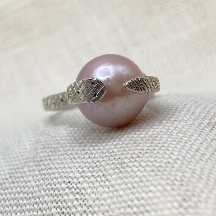 Sterling silver snake ring with blush pearl centerpiece
