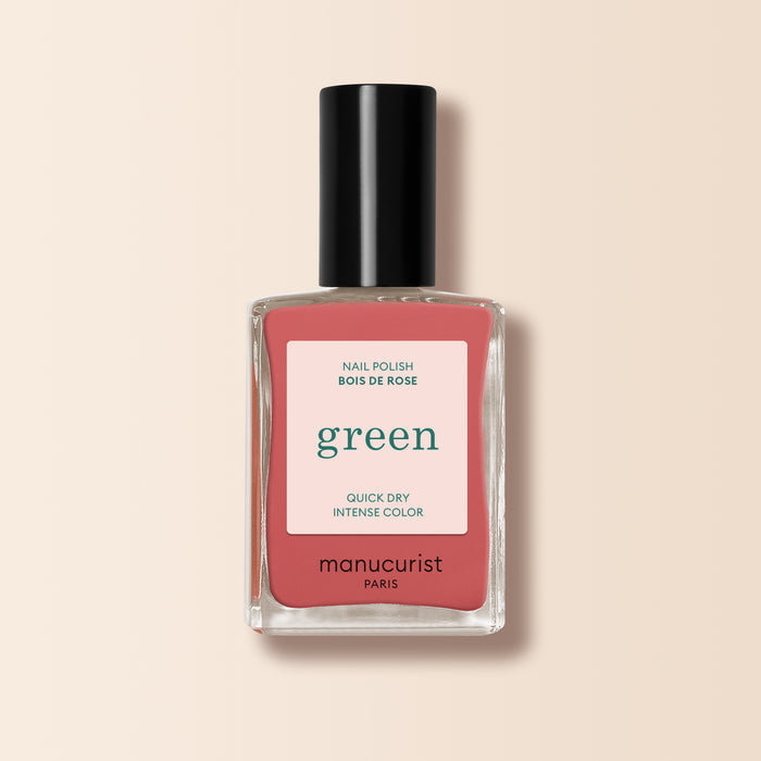 Manucurist's Bois de Rose nail polish features a dusty pink shade with a pink "green" label, delivering quick-dry, intense color on a pale beige background.