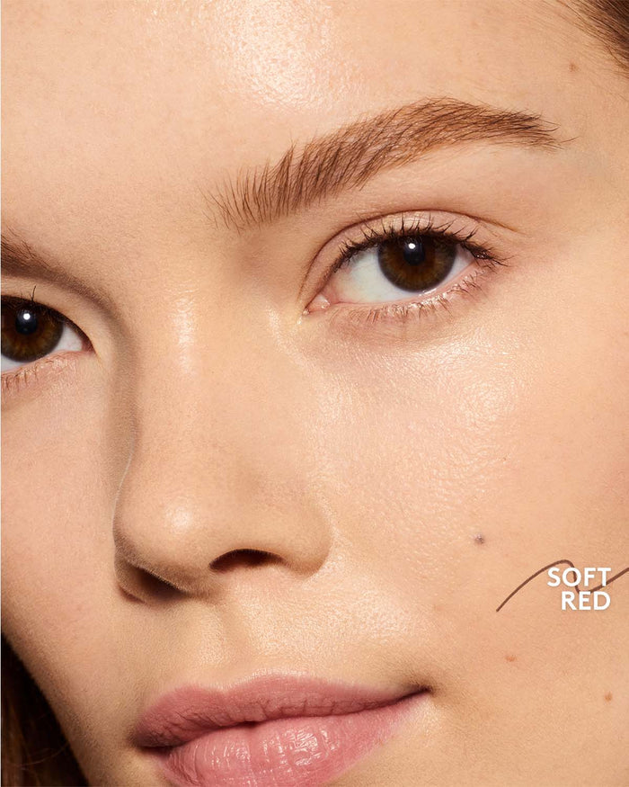 light skin toned model wearing brow MVP in soft red