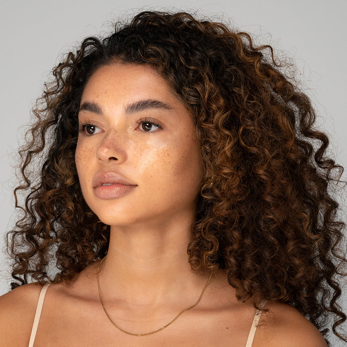Close-up of model wearing RMS Buriti Bronzer