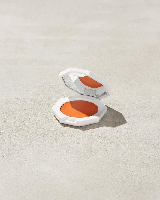 Cheeks Out Freestyle Cream Blush shown in shade Fuego Flush