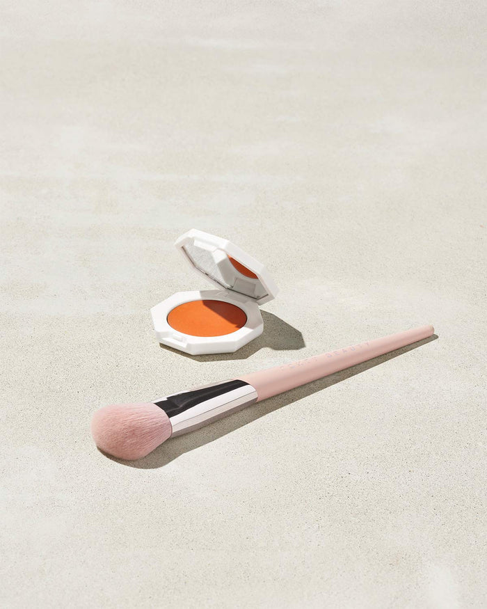 Cheeks Out Freestyle Cream Blush shown in shade Fuego Flush with Face Shaping Brush 125
