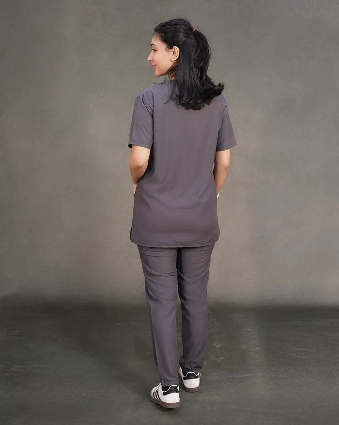 women wearing a gray Scrubs for doctors set against a plain background