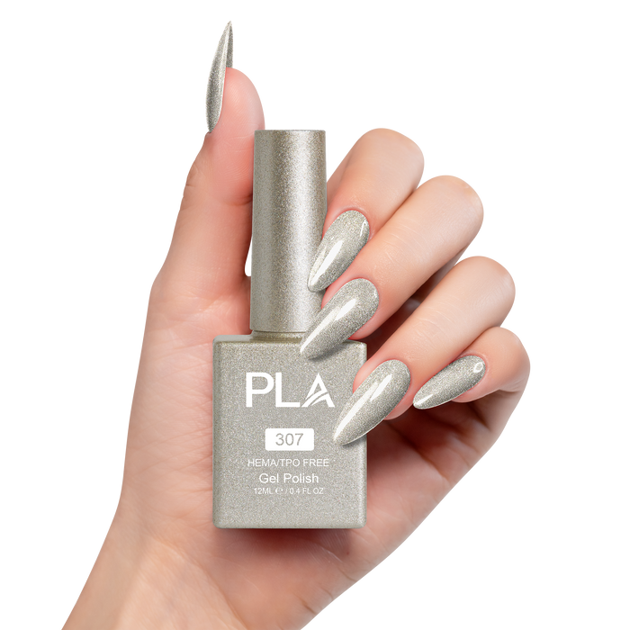 Hand holding a gold glitter gel polish bottle with matching nails on a white background