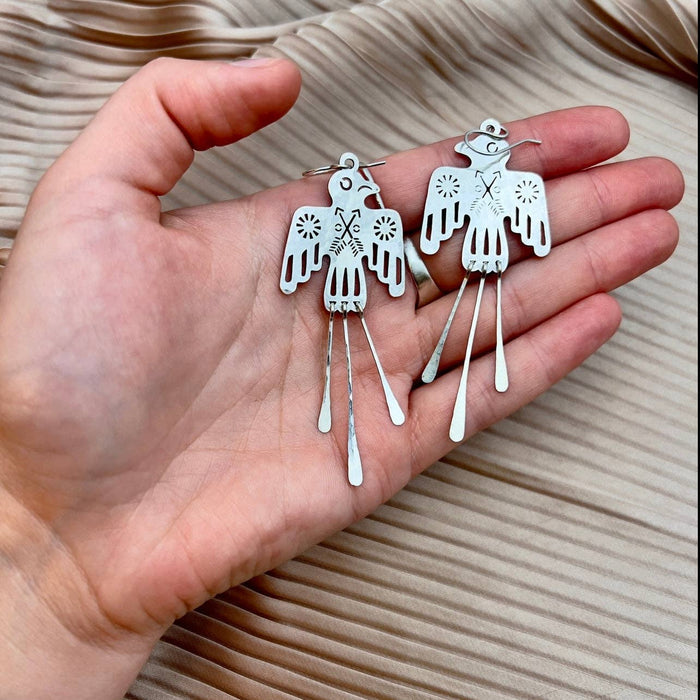 Elegant Glide Earrings by Fluff Hardware featuring sleek, minimalist design with shiny metal finish.