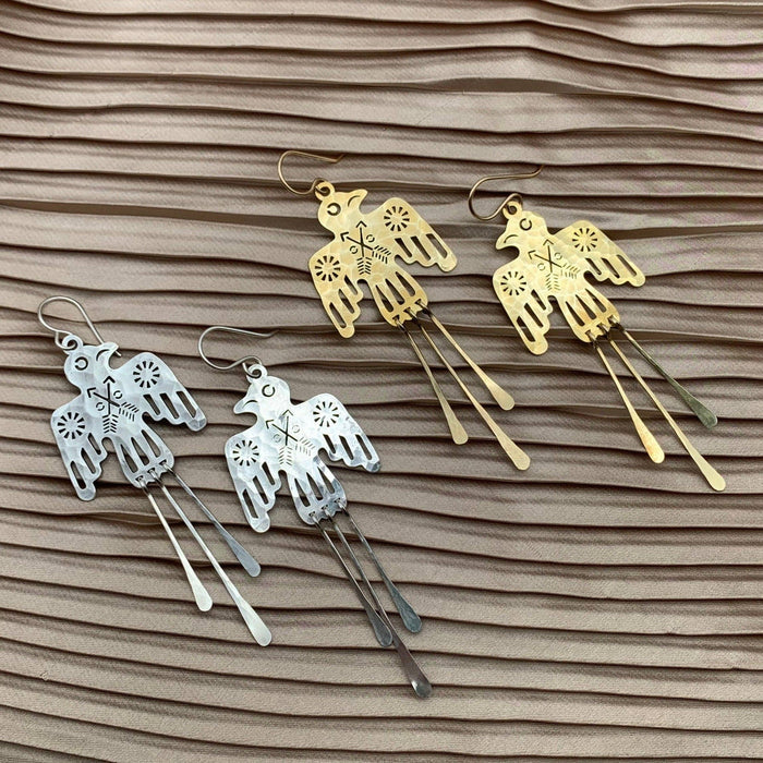 Silver Glide Earrings by Fluff Hardware featuring sleek, minimalist design with smooth, curved metal for a modern look.