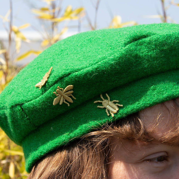 Golden embroidered bug pins featuring three small insect designs from Botanopia USA, perfect for plant lover decor and accessories.