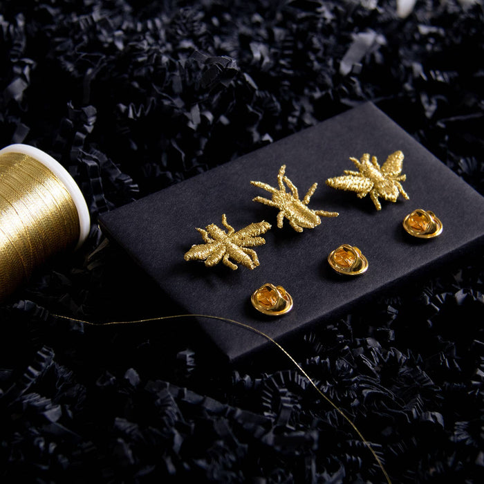 Golden embroidered brooch pins featuring three little bug designs, perfect for plant lovers and botanical decor.