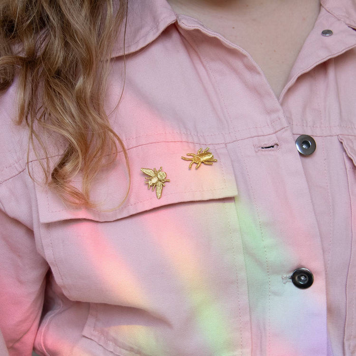 Golden embroidered bug pins featuring three small insect designs, perfect for plant lovers' decor or accessories.
