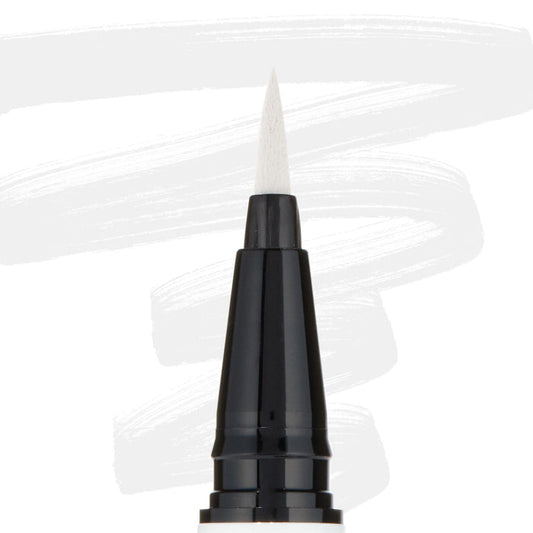 ColourPop BFF Liquid Liner Graceland creating bold white strokes with a fine felt tip; close-up of the black pen barrel and pointed brush, white eyeliner swatches behind, for precise wings and graphic eye looks.