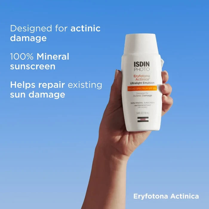 ISDIN Eryfotona Actinica ultralight mineral sunscreen bottle held against blue background