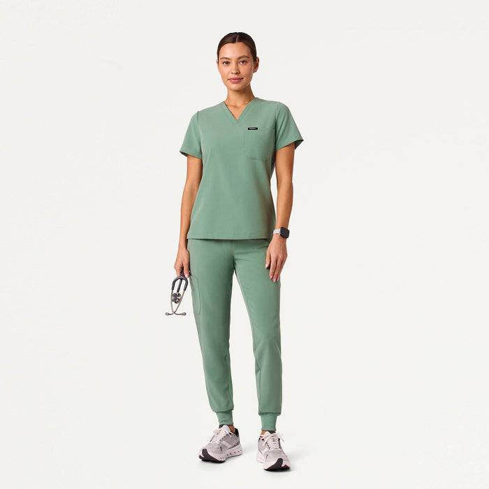 JAANUU Rhena Slim Essential 1 pocket Scrub Top Sage - Get Scrubbed