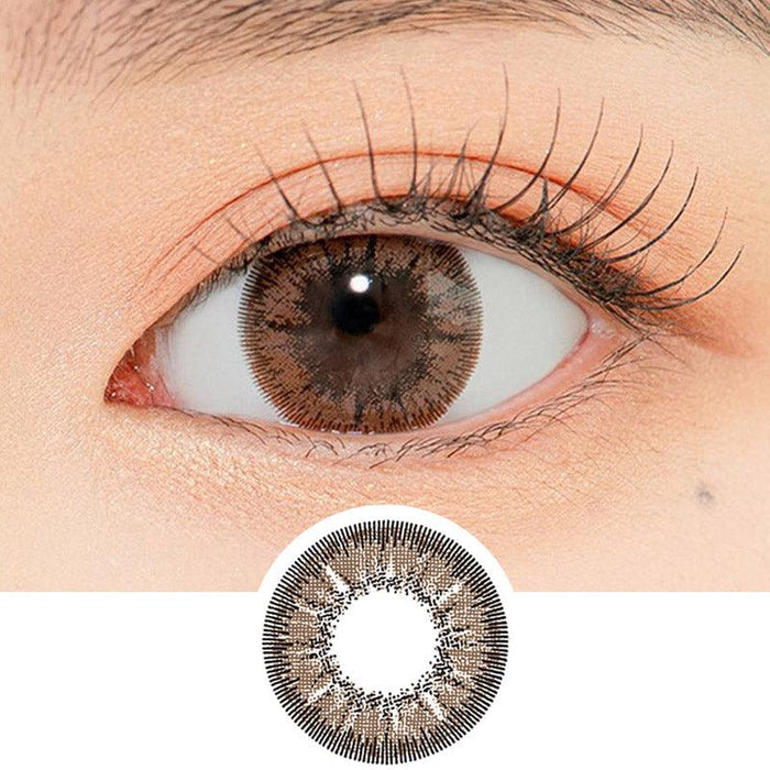 Close-up shot of a model's eye wearing Lensrang With Rang Choco color contacts with prescription, paired with K-beauty-inspired eye makeup, showing the brightening and enlarging effect of the circle contact lens on dark brown eyes, above a cutout of the contact lens pattern with limbal ring on a white background.