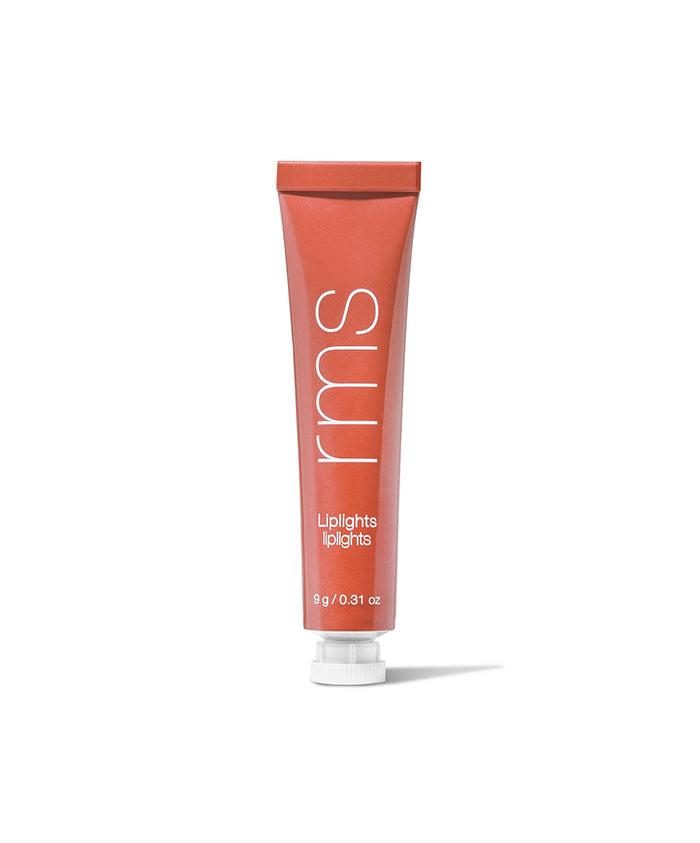 Tube of Liplights Cream Lip Gloss in a warm reddish coral shade with white text on the packaging, standing upright on a white background.