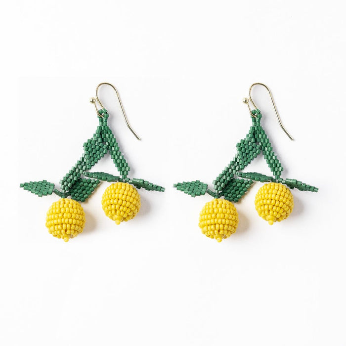 Beaded dangle earrings with green bows and yellow cherry-style beads on hooks
