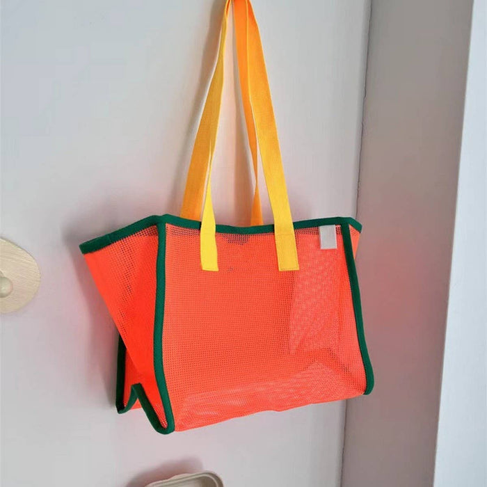 Mesh beach bag by ACCITY with breathable design, ideal for carrying towels, sunscreen, and beach essentials.