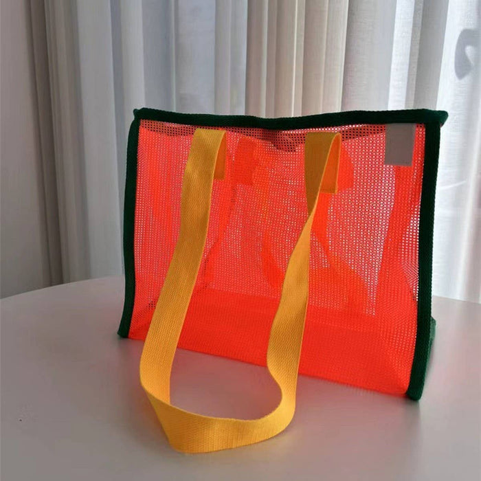 Mesh beach bag by ACCITY with spacious design and sturdy handles, perfect for carrying beach essentials and keeping items ventilated.