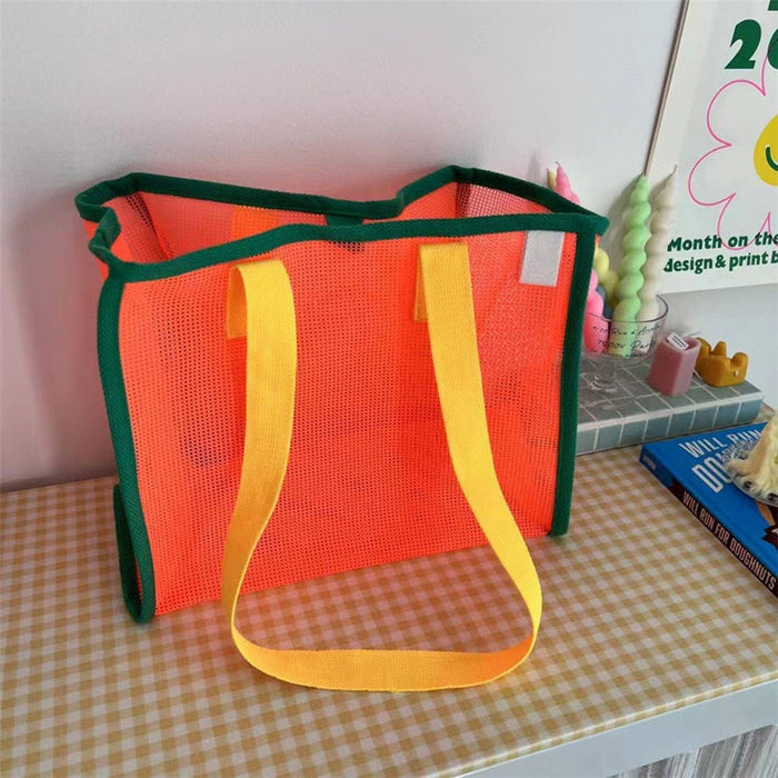 Black mesh beach bag by ACCITY with sturdy handles, perfect for carrying towels, sunscreen, and beach essentials.