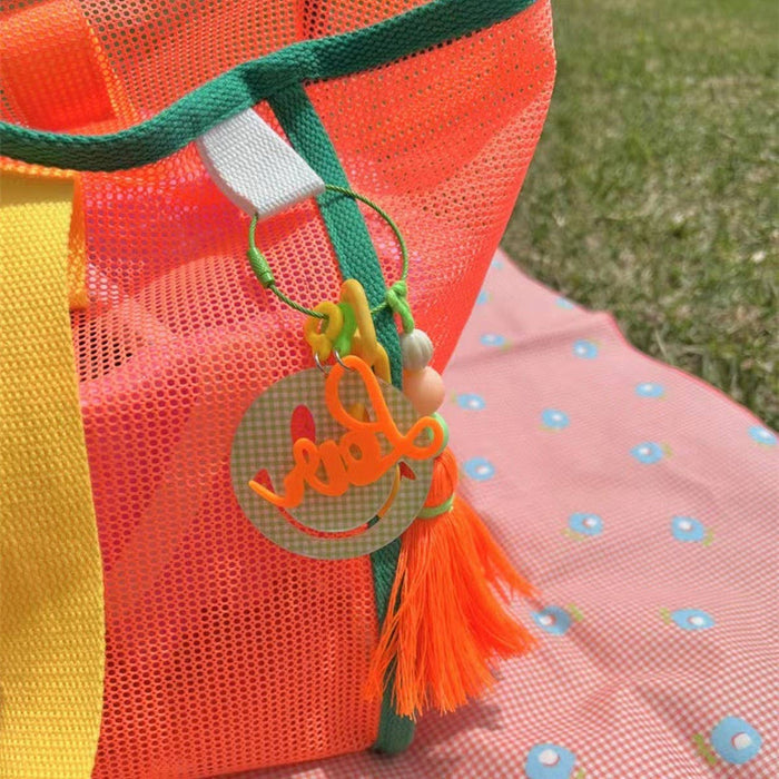 Mesh beach bag by ACCITY with transparent design, sturdy handles, perfect for carrying towels and beach essentials.