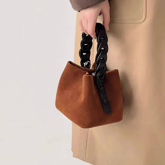 Mini woven bag from ACCITY featuring a compact design with braided handles and natural woven material.
