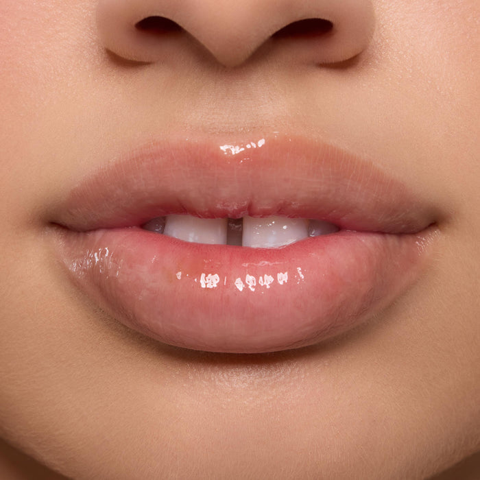 Shiny, moisturized lips wearing the Orange Vanilla Lip Mask in a tight studio close-up, highlighting high gloss and smooth texture as part of the ColourPop Lip Care Kit.