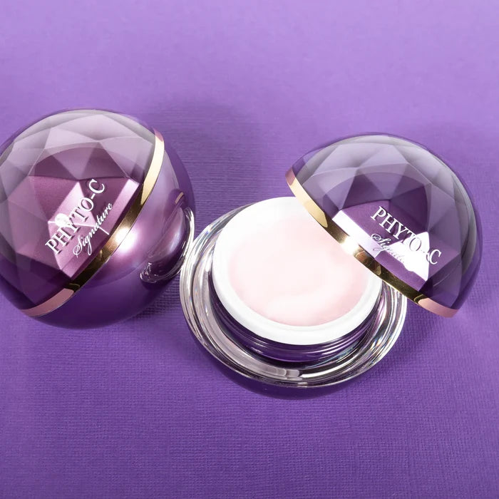 Phyto-C Signature Cream jar with purple faceted lid and open pink cream