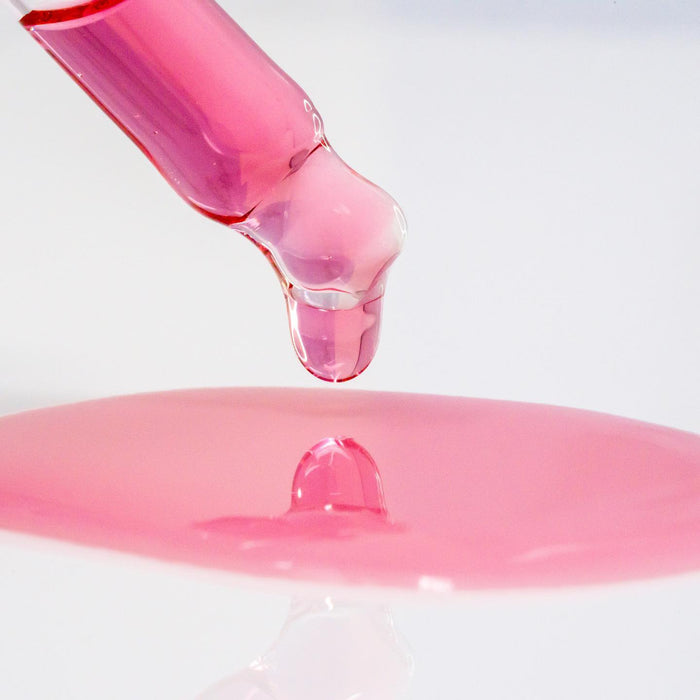 Pink wrinkle correcting gel drop with hyaluronic acid serum texture
