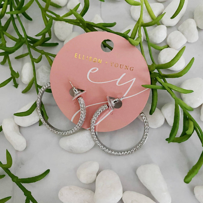 Reversible Ellison+Young hoop earrings with plain and shiny sides, showcasing a stylish, versatile jewelry design.
